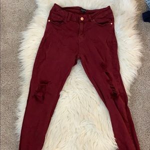 Burgundy ripped jeans